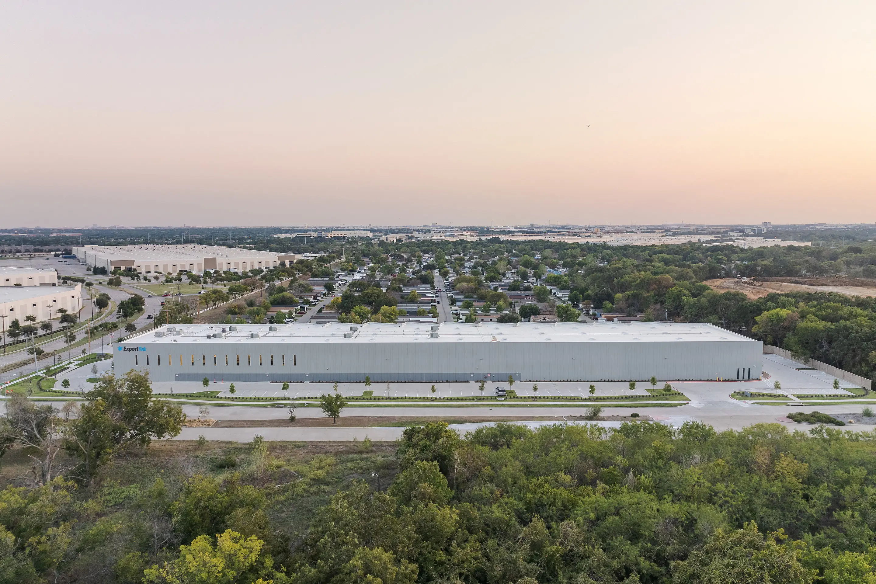 Aerial view of the WesternTechSystems facility at dusk